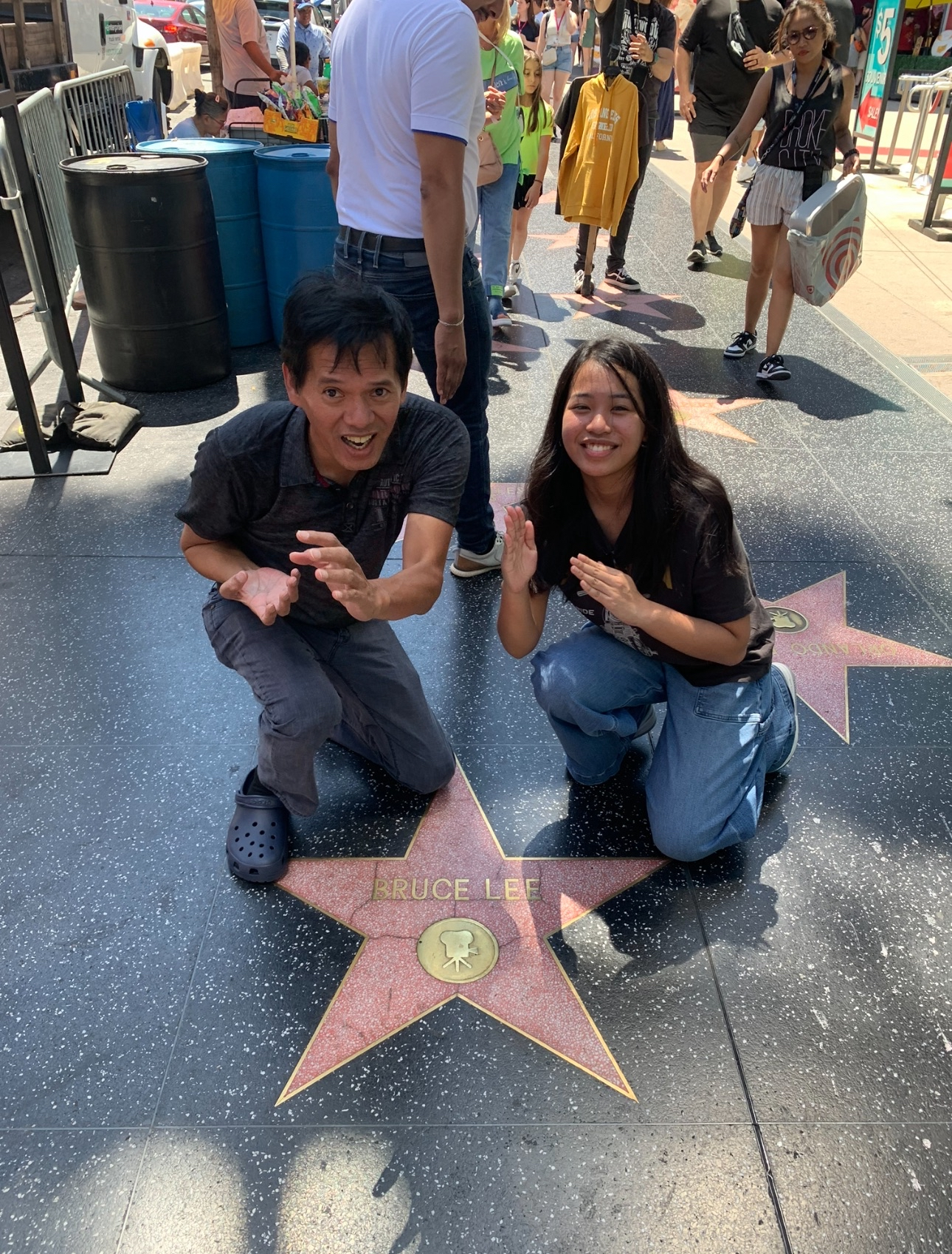 Samantha kneeling beside a star on the Hollywood Walk of Fame