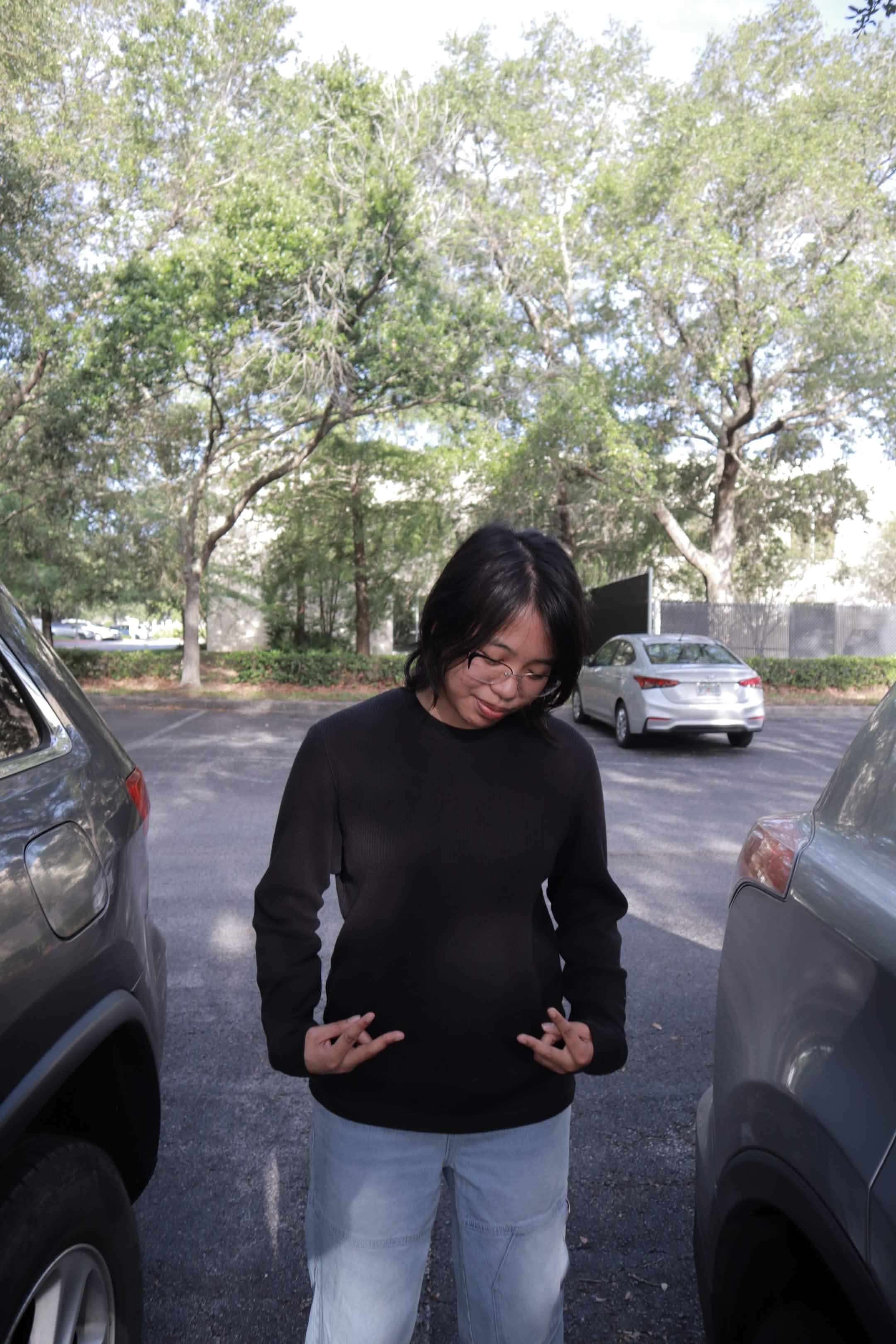 Portrait in a tree-lined parking lot